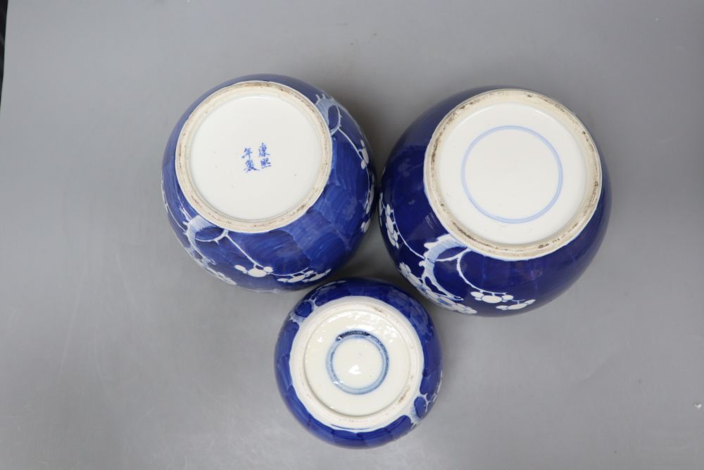 Three Chinese blue and white prunus jars, one with apocryphal kangxi mark